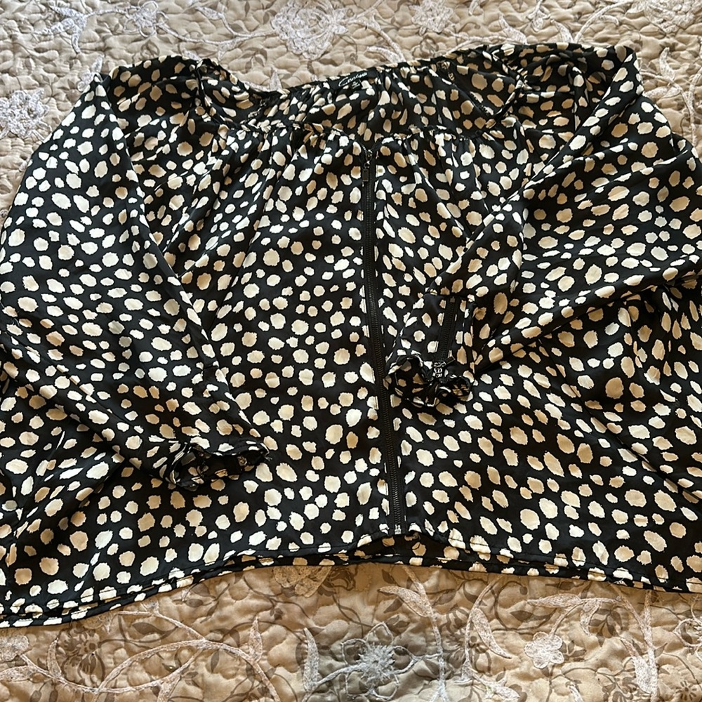 Polka dot blouse.